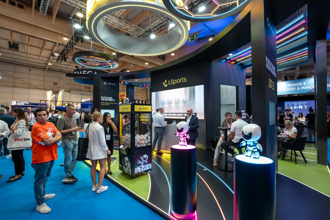 Attendees walking the SBC Summit Lisbon exhibition floor
